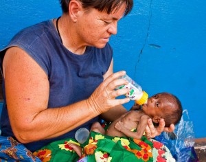 Baby Dixon receives his first bottle from Brenda